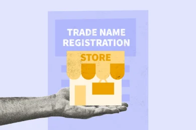 Person holding a model of a store to represent the process of completing trade name registration documents
