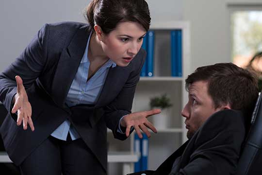 Boss bullying and harassing an employee at work