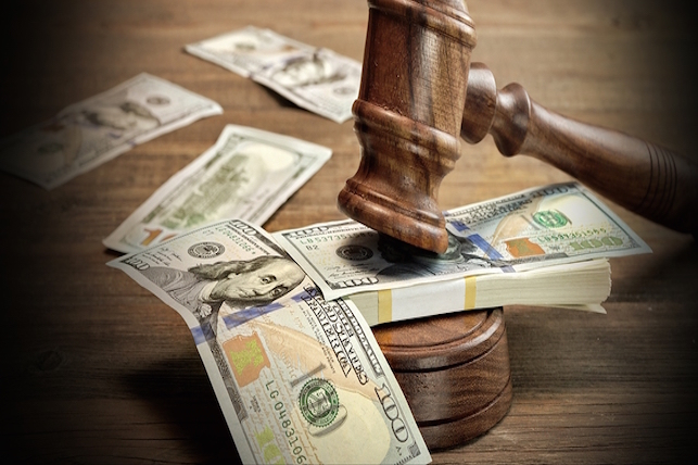 gavel on $100 bills