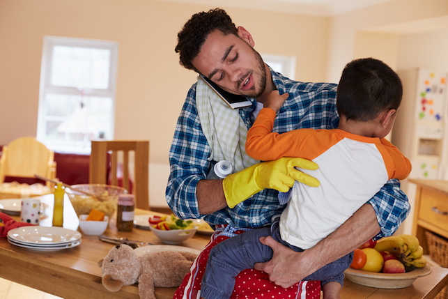 Busy father juggles taking care of his kid and other commitments
