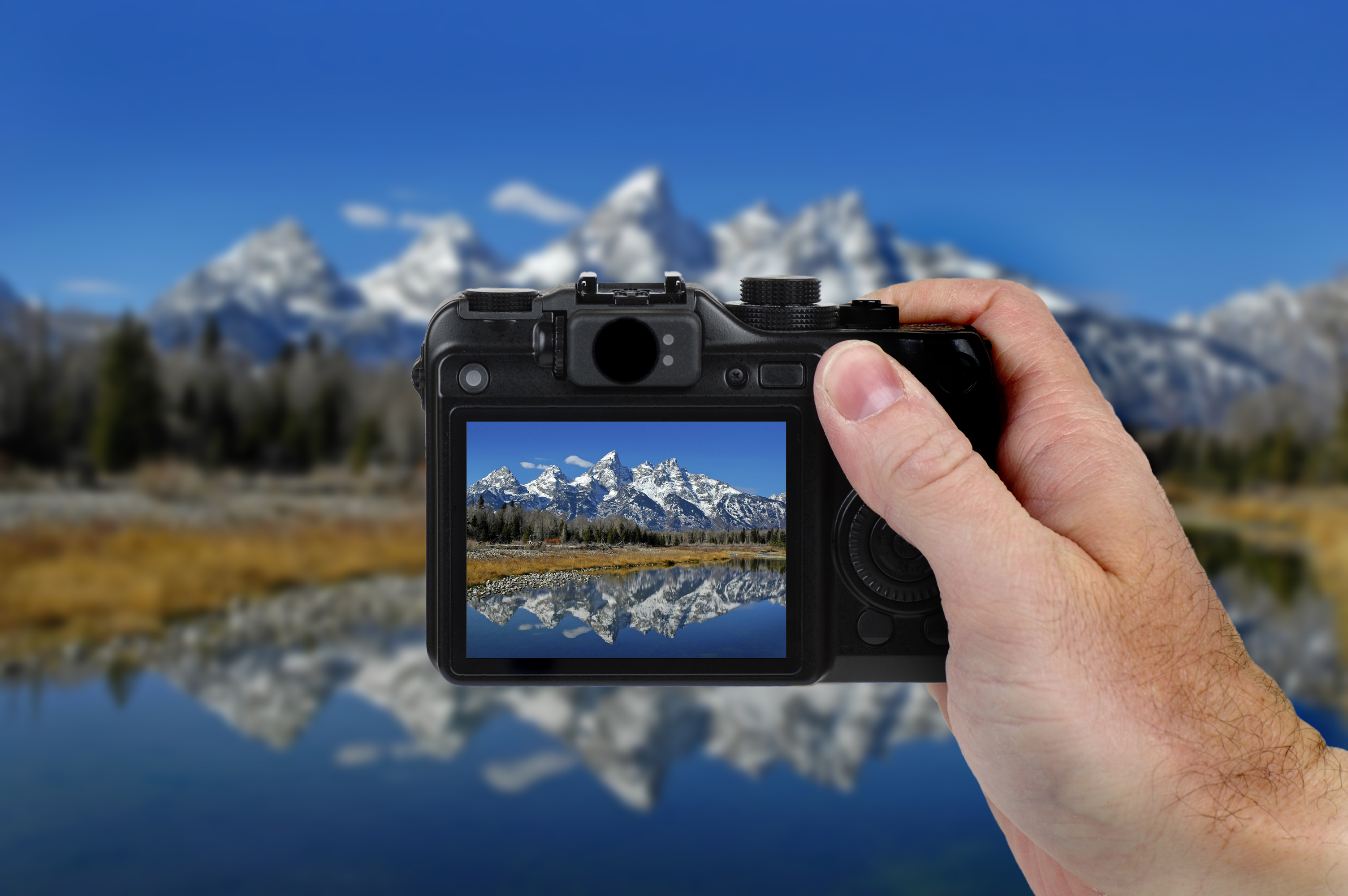 photographer-taking-photos-of-mountains