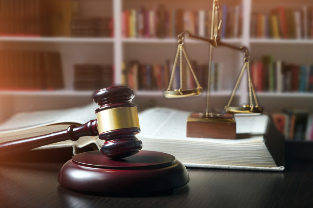 judge and gavel with library background