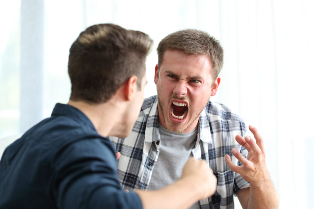 Angry roommates fighting after a disagreement