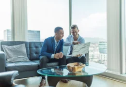 business men looking at computer