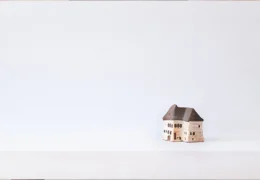 Brown Wooden House Miniature on White Surface