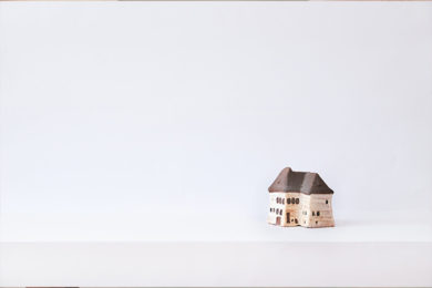 Brown Wooden House Miniature on White Surface