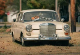 Car with a for sale sign in the window