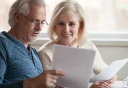 elderly couple looking at important end of life documents