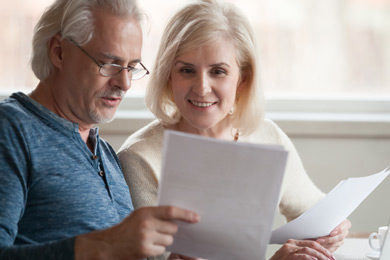 elderly couple looking at important end of life documents