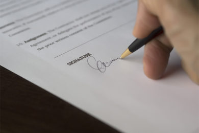 Selective-Focus-Photography-of-Person-Signing-on-Paper-