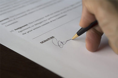 Selective-Focus-Photography-of-Person-Signing-on-Paper