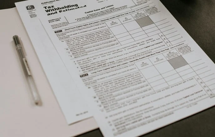 Tax Form 1040 with a pen