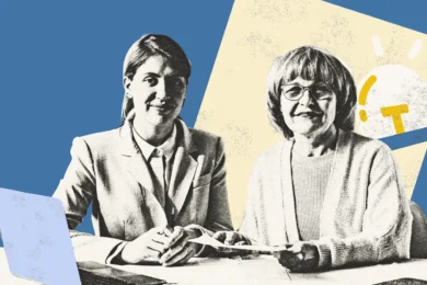 Middle aged woman and elderly woman sitting at a table holding a document