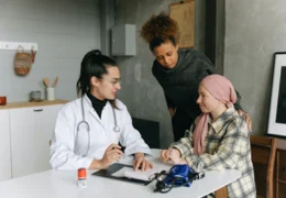 A principal and agent talk to doctor about living will and medical power of attorney provisions.