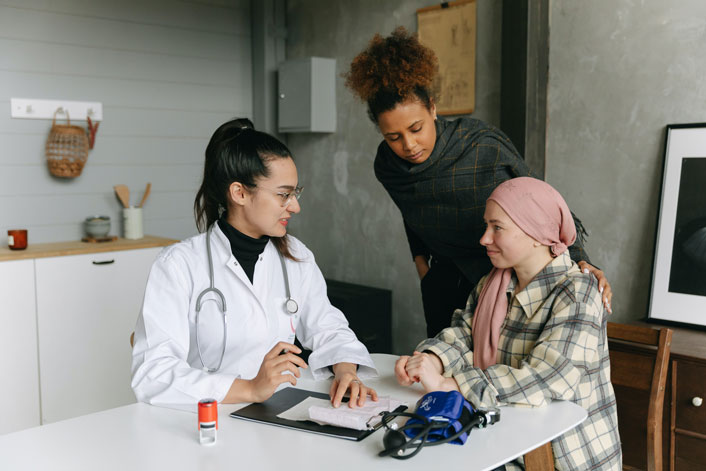 A principal and agent talk to doctor about creating a living will and healthcare power of attorney