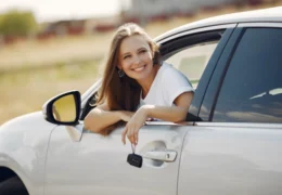 Woman with a used car
